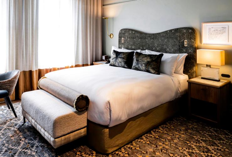 A boutique hotel room with a large bed and a vintage carpet at The Grand National by Saint Peter, Sydney, New South Wales © Christopher Pearce A boutique hotel room with a large bed and a vintage carpet at The Grand National by Saint Peter, Sydney, New South Wales © Christopher Pearce