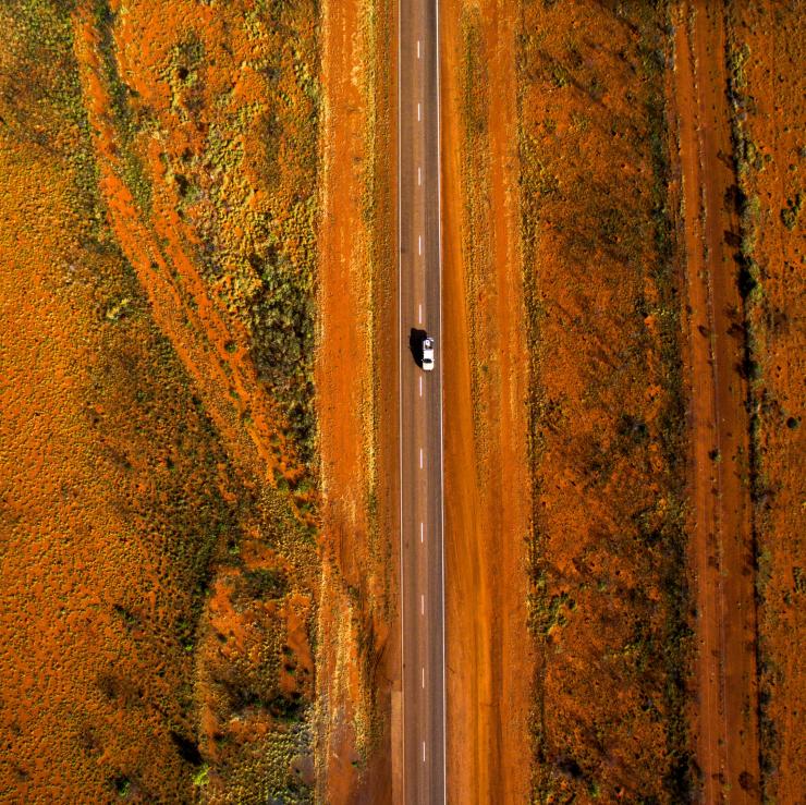 Aerial of a car driving along the Stuart Highway in the Alice Springs Region © Tourism NT, Sam Earp Aerial of a car driving along the Stuart Highway in the Alice Springs Region © Tourism NT, Sam Earp