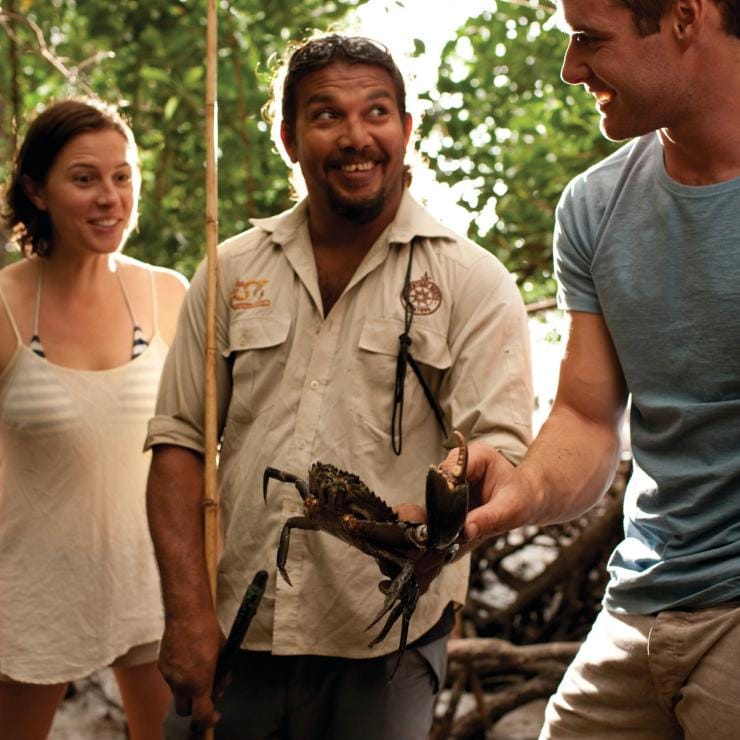 Visitors catching mud crabs on a Walkabout cultural Adventures tour © Walkabout Cultural Adventures Visitors catching mud crabs on a Walkabout cultural Adventures tour © Walkabout Cultural Adventures