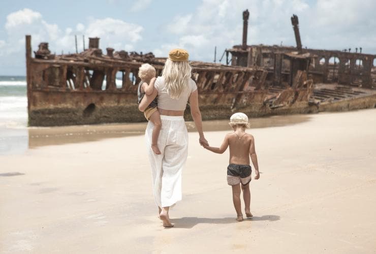 Family looking at S.S. Maheno on K’gari, Queensland © Tourism and Events Queensland Family looking at S.S. Maheno on K’gari, Queensland © Tourism and Events Queensland