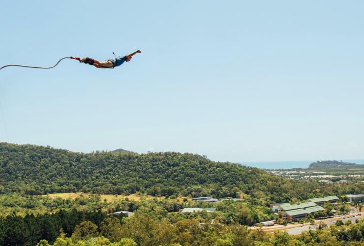 A person mid air while bungee jumping in a forest with AJ Hackett Bungy Jumping, Cairns, Queensland © Tourism Tropical North Queensland 