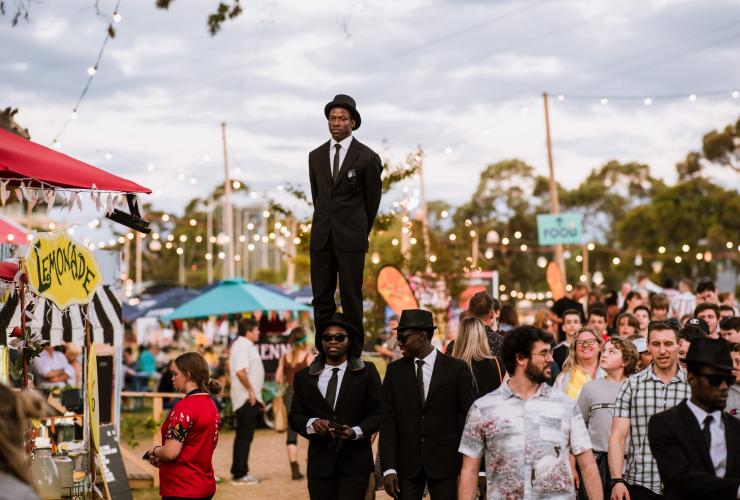 A man stands on another man’s shoulders amongst the crowd at Adelaide Fringe, Adelaide, South Australia © Meaghan Coles