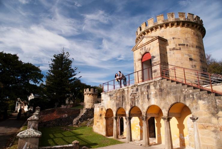 A couple standing among the old brick buildings at the Port Arthur Historic Site, Port Arthur, Tasmania © Port Arthur Historic Site Management Authority