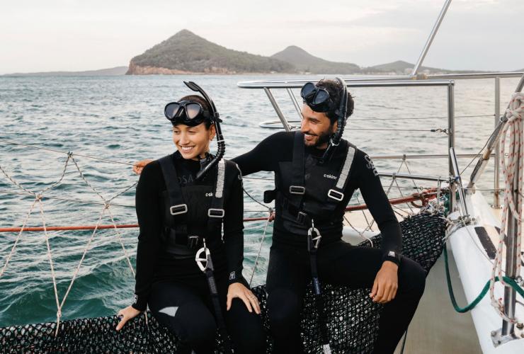 Couple enjoying a day out on the water with Dolphin Swim Australia, Port Stephens © Destination NSW 